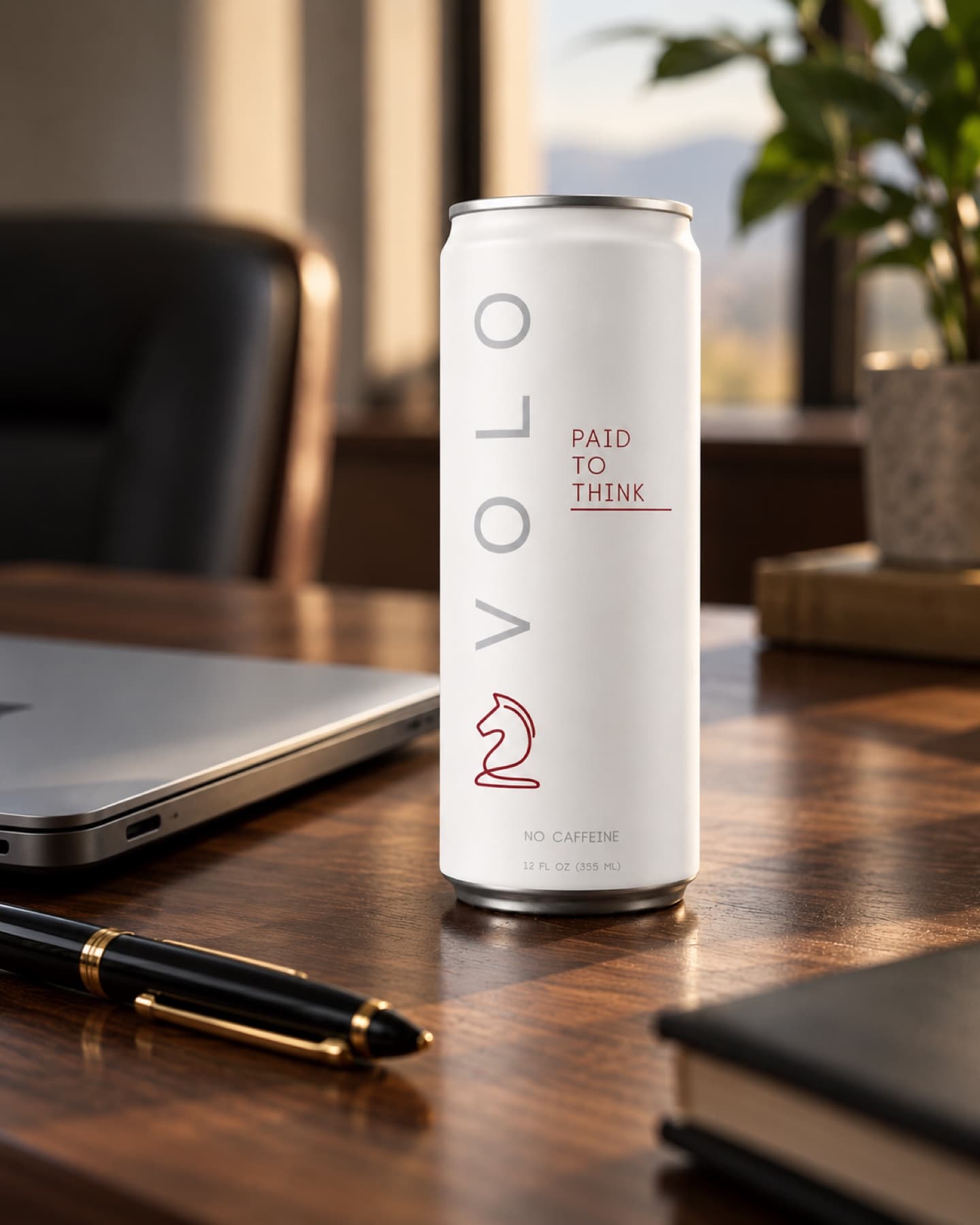 VOLO Cognitive Performance Drink on an executive desk beside a laptop and pen
